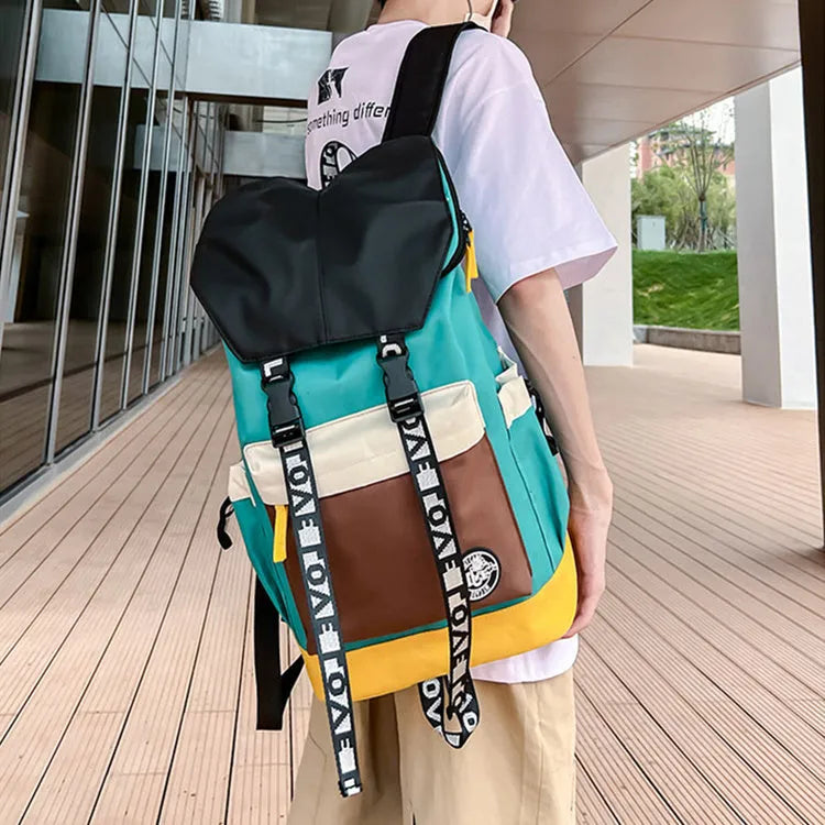 Oxford cloth backpack shown in black, green or red with handheld and shoulder straps.