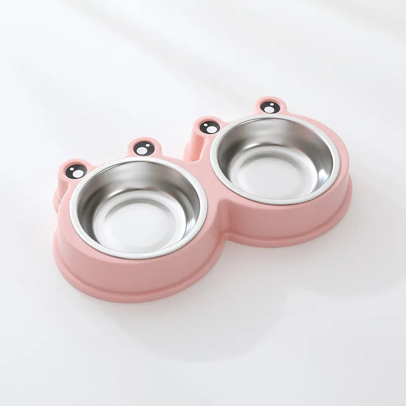 Blue stainless steel double pet bowl with frog design, showing separate food and water compartments on a non-slip base.