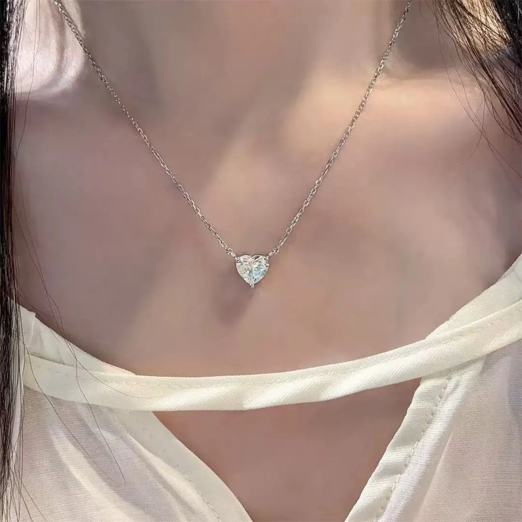 Women's silver necklace with heart-shaped pendant on simple chain