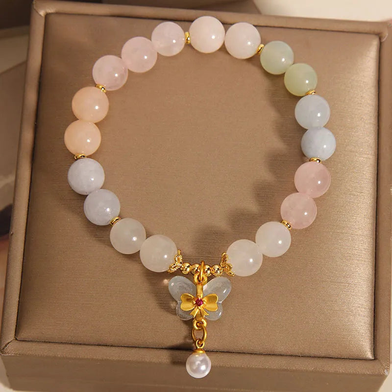 Women's crystal bracelet with natural Morganite butterfly pendant in colourful gemstone tones.