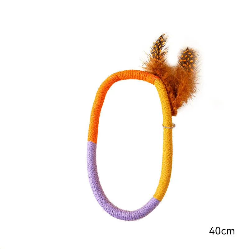 Circular green cotton rope cat toy with feathers and catnip for indoor cats
