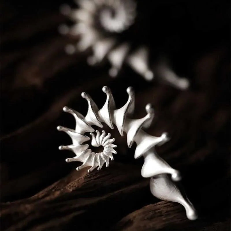 Three-dimensional matte finish conch shell stud earrings with exaggerated design and irregular patterning