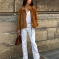 Loose fit solid colour retro jacket with long sleeves on mannequin