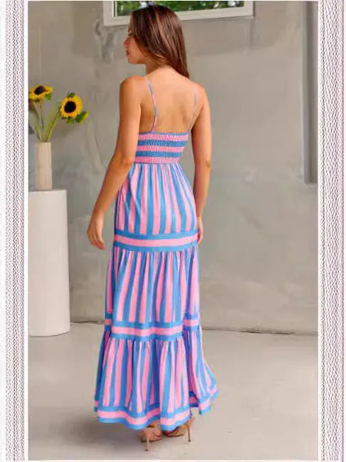 Women's striped backless summer dress with shoulder suspenders and square neckline showing integrated pockets