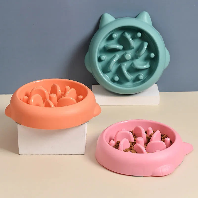 Green bone-shaped slow feeder bowl for dogs with raised maze pattern inside