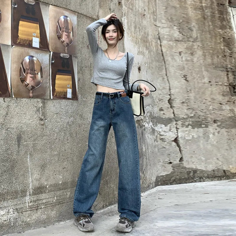 Women's retro blue high-waisted straight leg denim jeans on a neutral background.