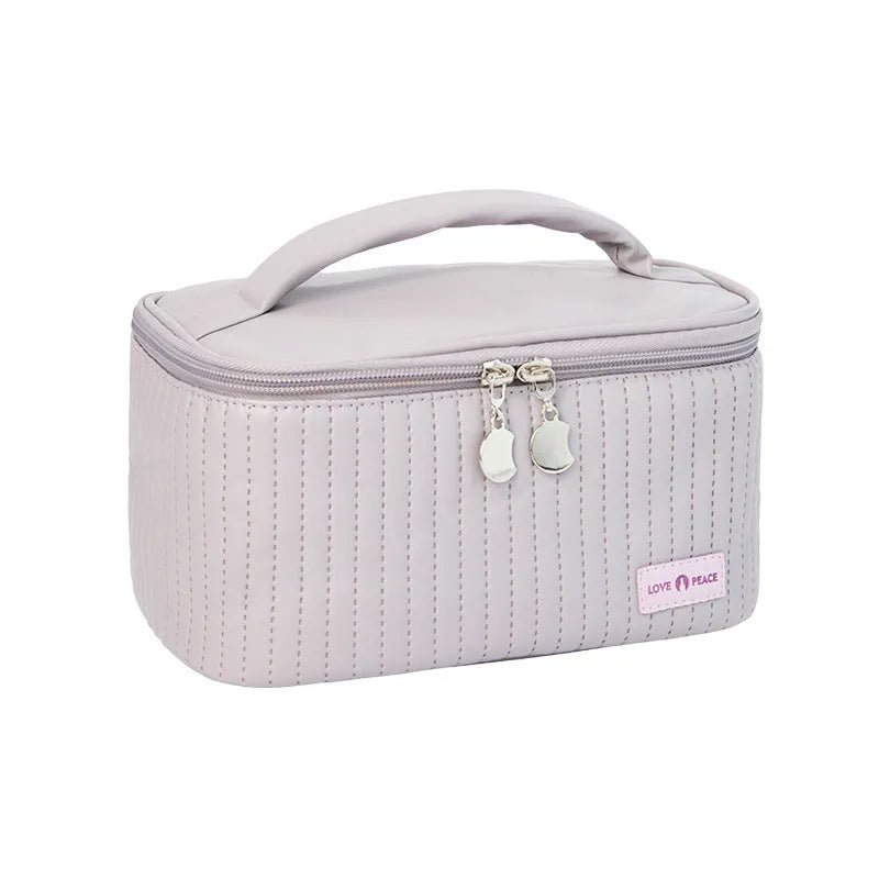 Open-top rectangular makeup bag in pastel PU leather showing quick-access design