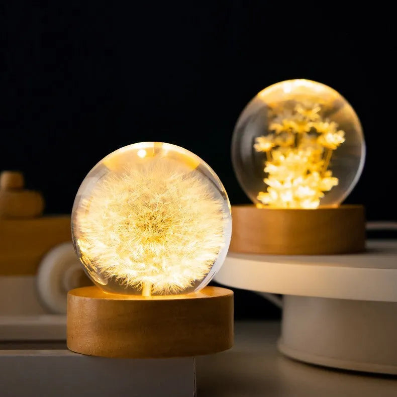 Luminous 3D dandelion crystal ball LED lamp on a beech wood stand, with USB plug.