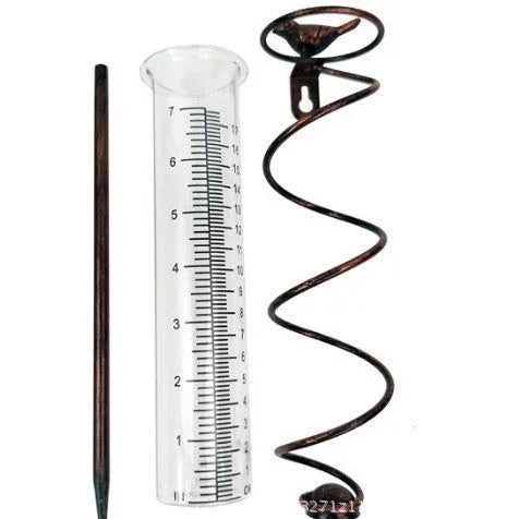 Cast iron garden rain gauge with hummingbird decoration showing 1-20 scale markings