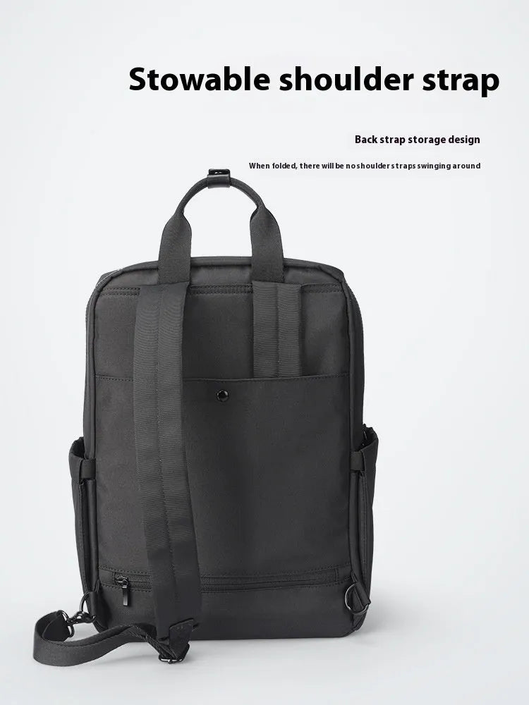 Black Oxford cloth computer backpack with a polyester lining, showing storage compartments.