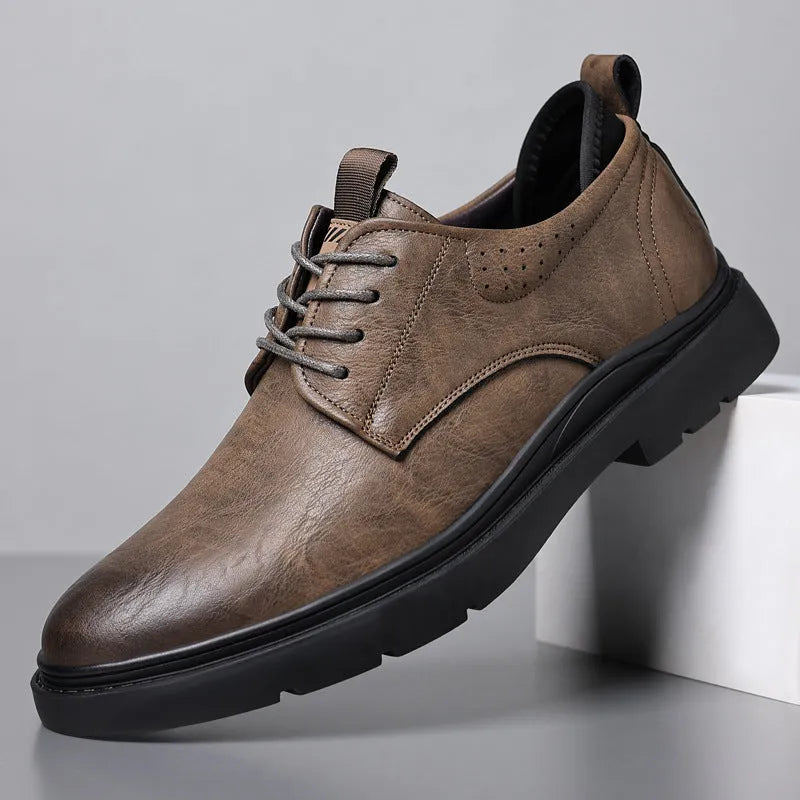 Men's black and brown leather casual sneakers with decorative stitching and a rubber sole.
