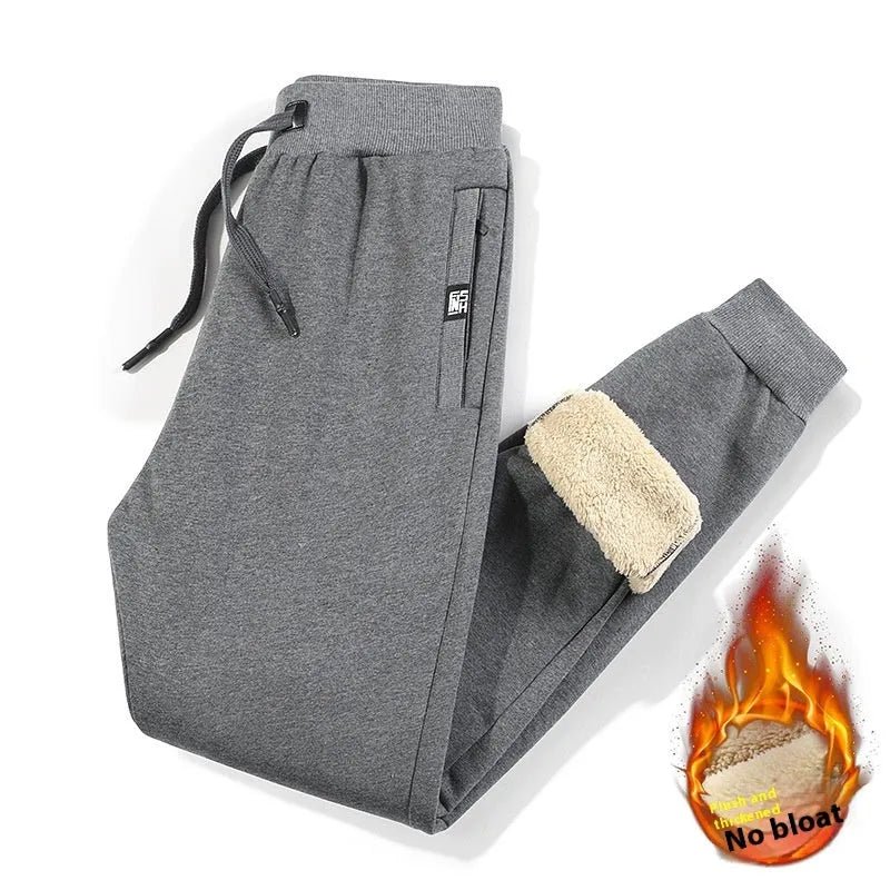 Men's grey fleece-lined track pants with elastic waistband shown flat