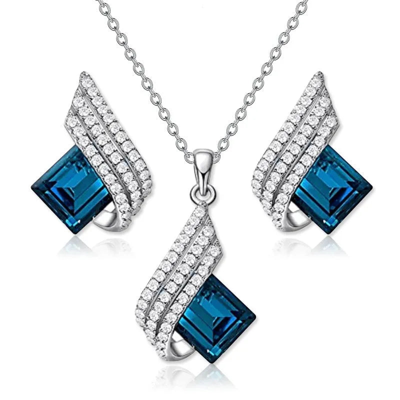 Women's necklace and earring set with a glass pendant on an electroplated alloy cross chain.