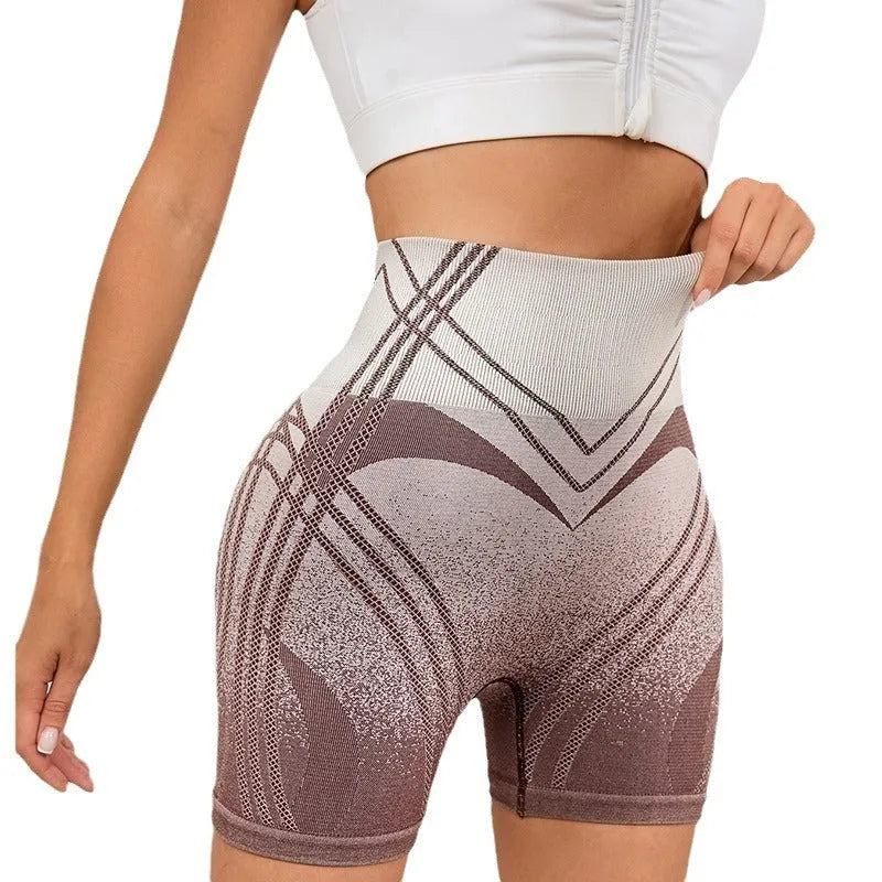 Women's high waisted gradient fitness shorts in black, shown for yoga and running.