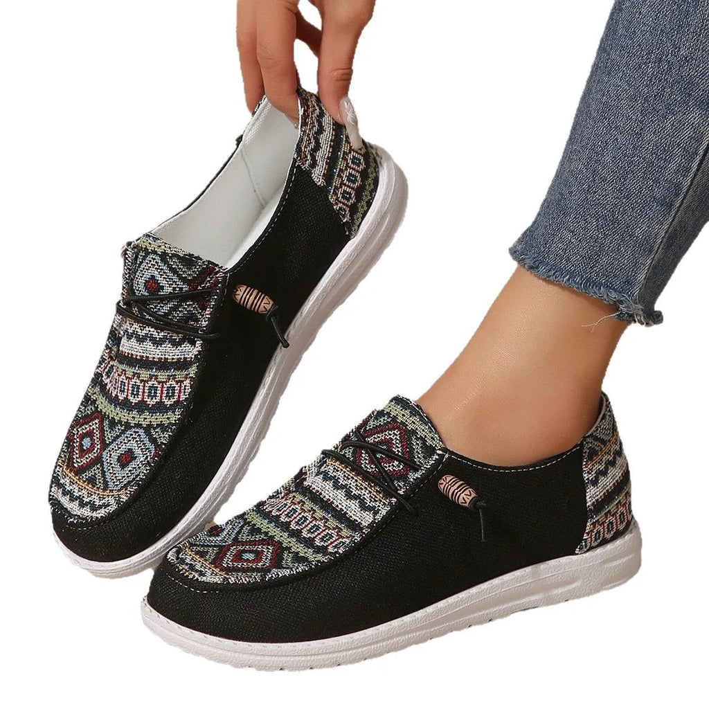 Women's flat slip-on shoes in black, dark grey, and khaki with round toe and rubber sole.