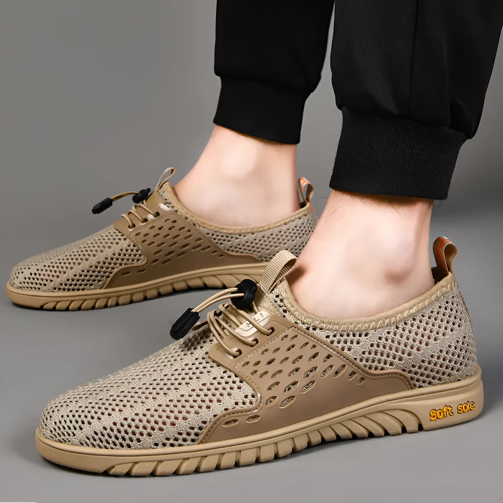 Men's breathable mesh casual shoe in sand colour with elastic band and rubber sole.