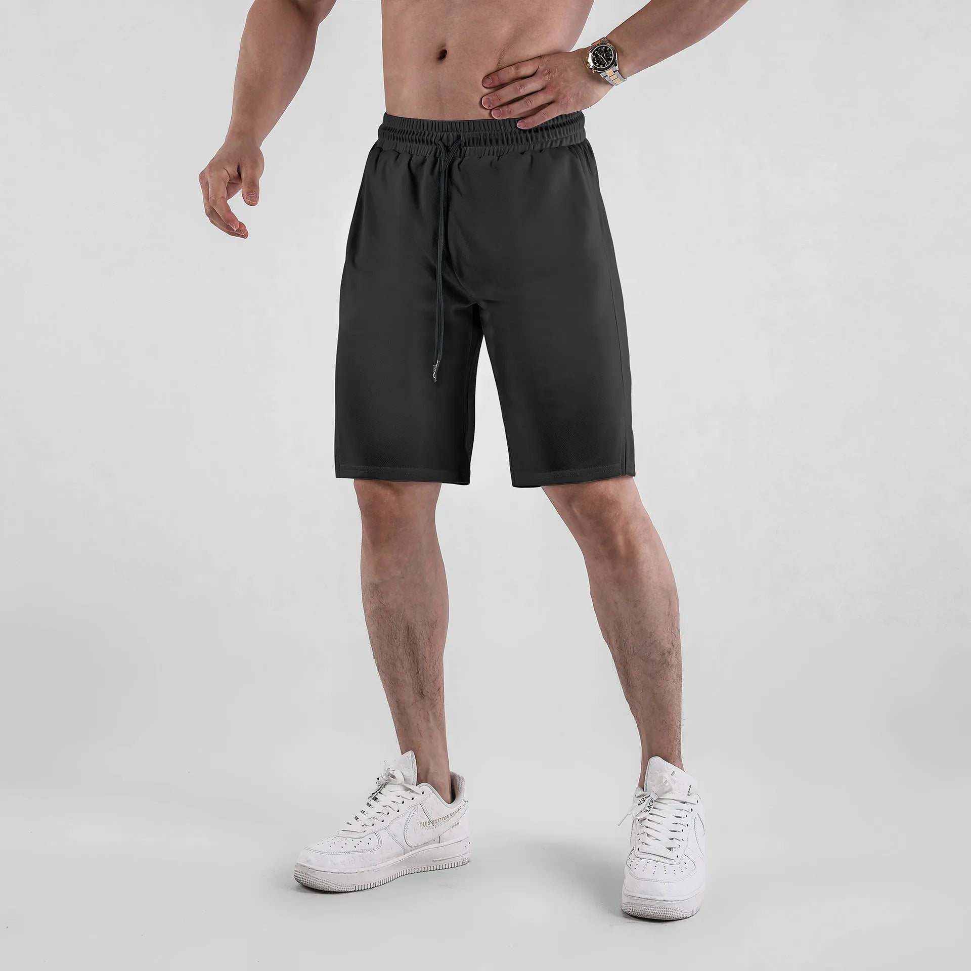 Men's black quick-drying mesh capri pants with elastic waistband and mid-length cut