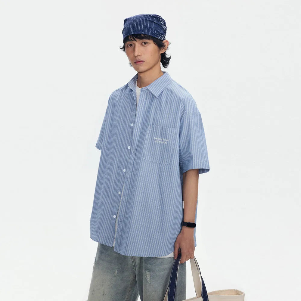 Blue and white striped short-sleeved cardigan-style shirt on a hanger