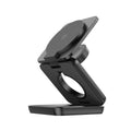 Foldable magnetic wireless charging phone holder in black on a desk