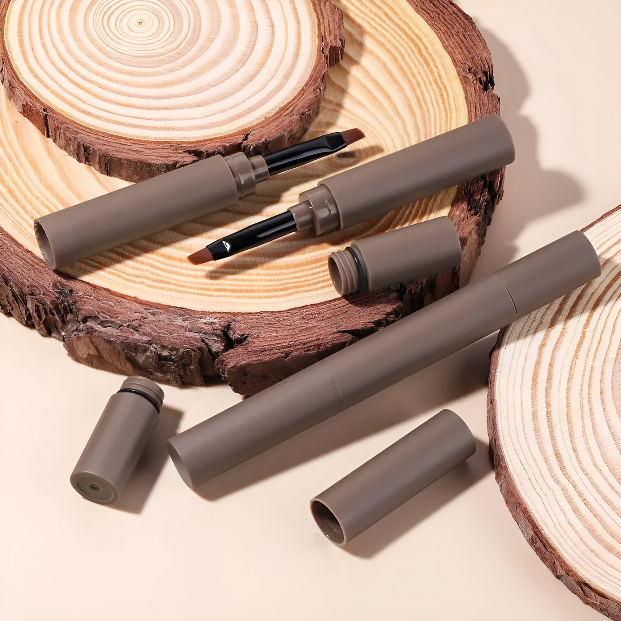 Dual-ended eyebrow cream for natural brow shaping and filling in five colour shades.