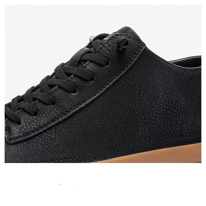 Men's black leather casual shoes with round toe, flat heel, and lace-up closure on rubber sole