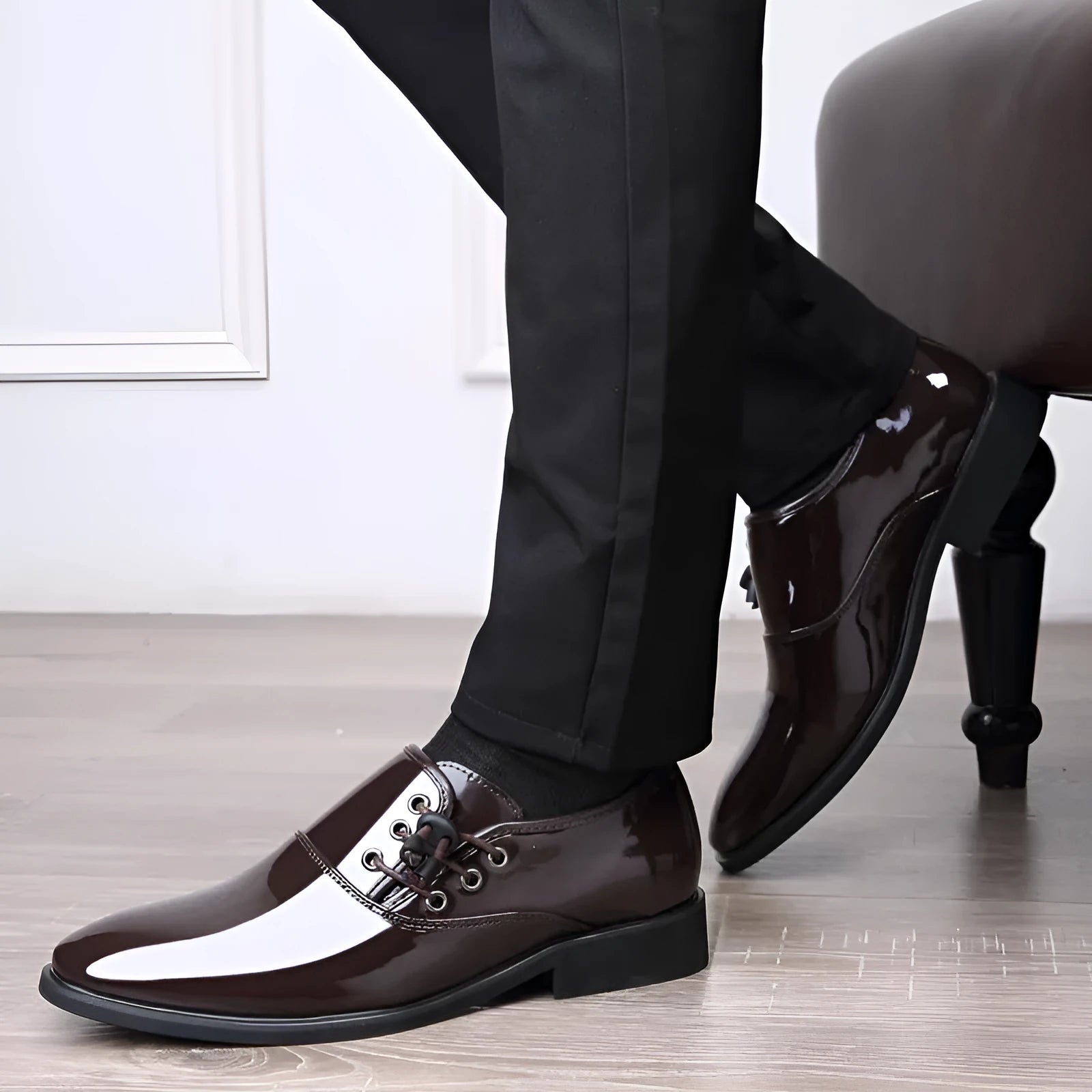 Men's black and brown formal business shoes with round toe and square heel on a rubber sole