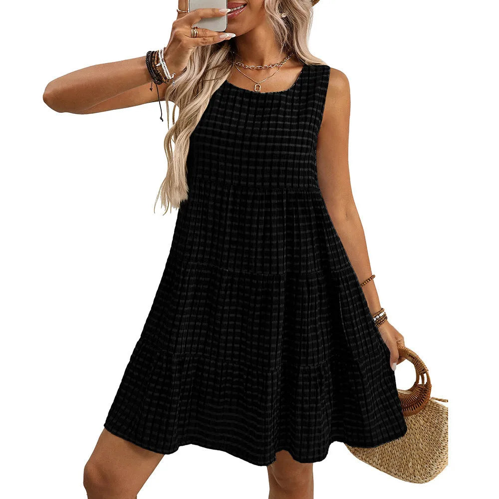Women's light blue sleeveless plaid dress with loose swing skirt and high waist on a model.