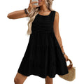 Women's light blue sleeveless plaid dress with loose swing skirt and high waist on a model.