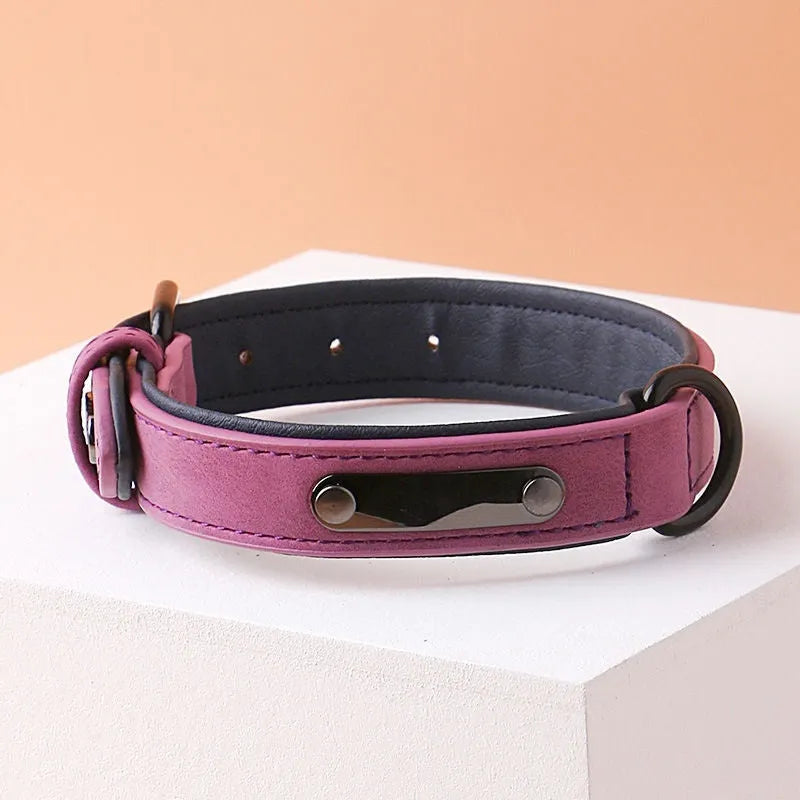 Adjustable dog collar in purple with PU leather front and microfiber fabric backing on a white background.