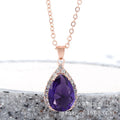 Pink drop shape women's necklace with geometric pendant design and rhinestone details