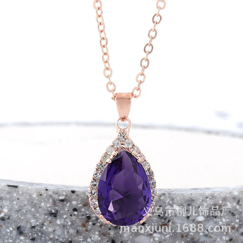 Pink drop shape women's necklace with geometric pendant design and rhinestone details