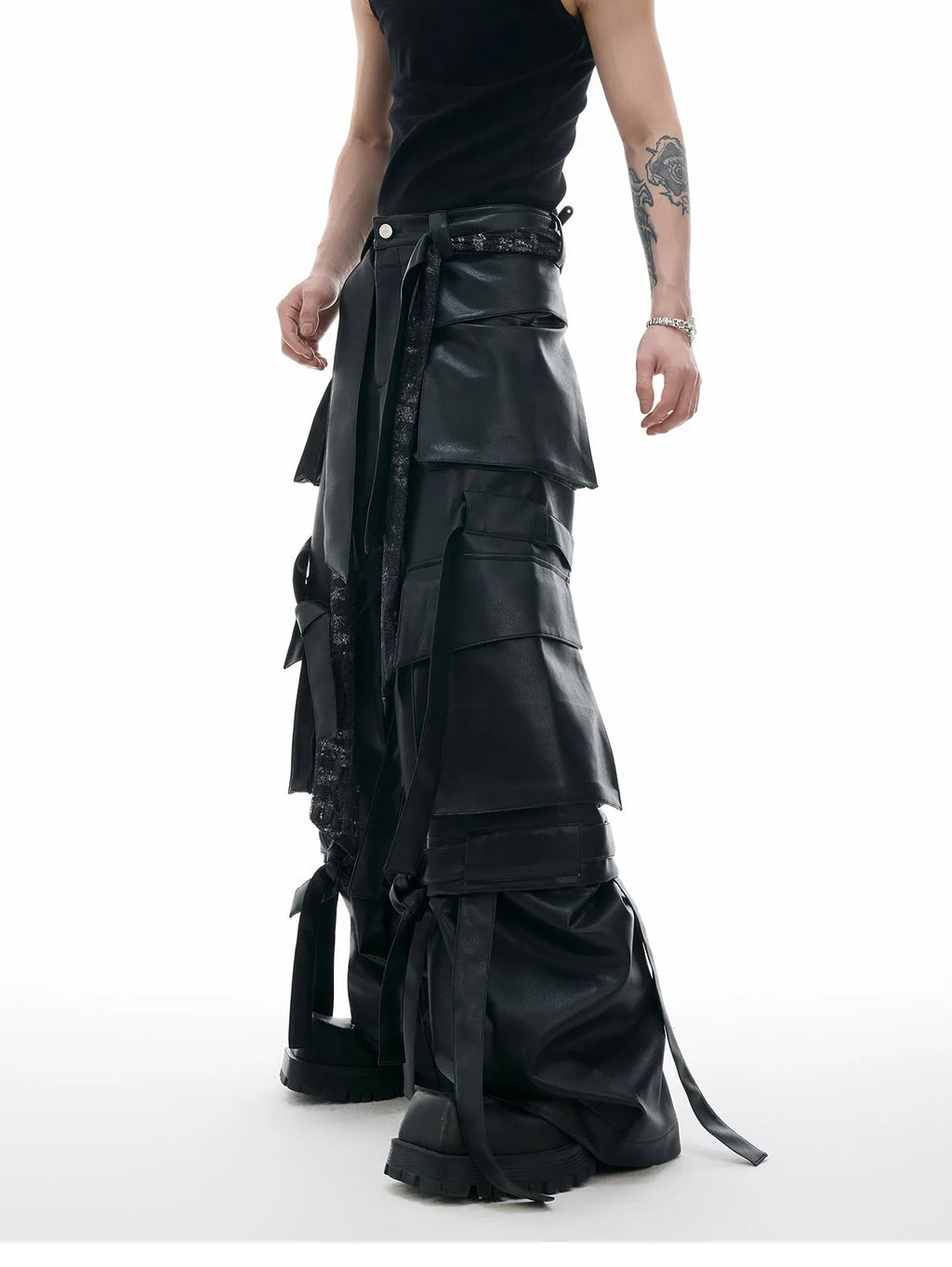 Black loose-fit retro trousers with quilted panels and multi-pocket stitching detail.