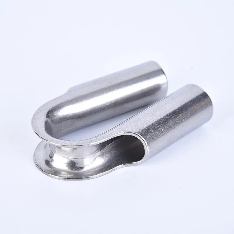 Stainless steel tubular chicken heart ring round sleeve ring set on a workshop surface
