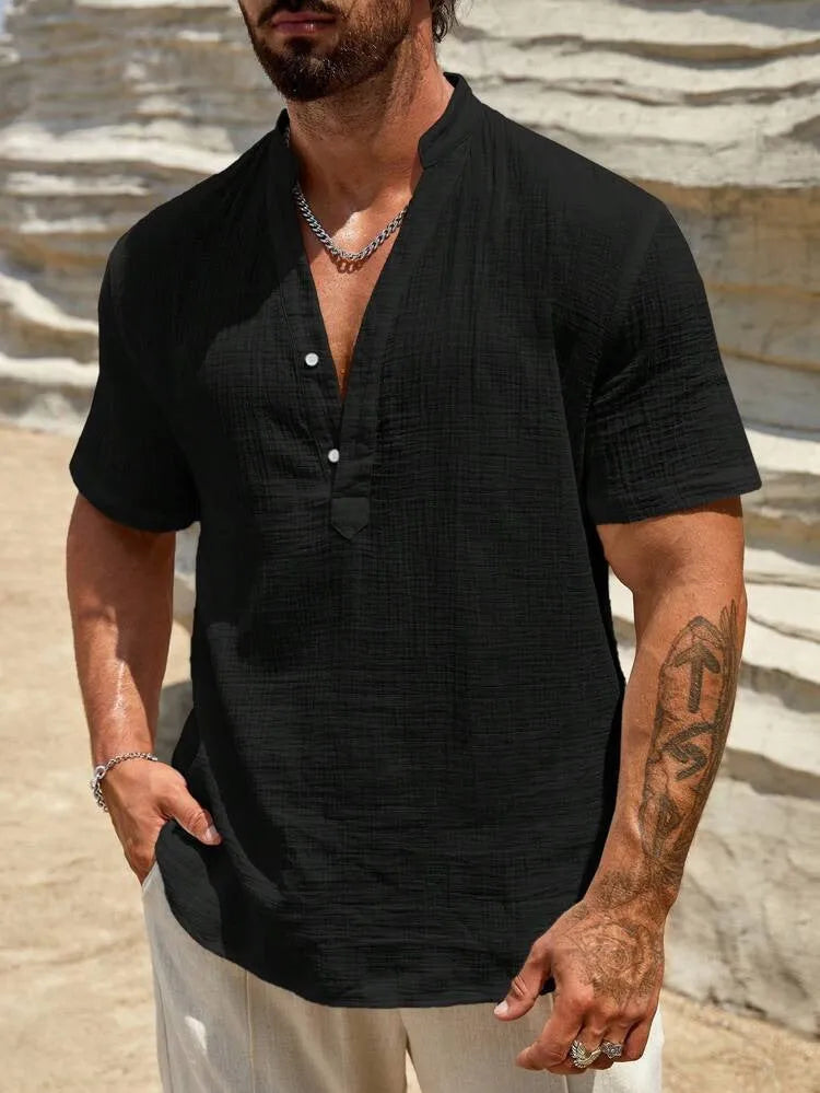 Man wearing a light blue short-sleeved stand collar shirt made from thin polyester blend fabric