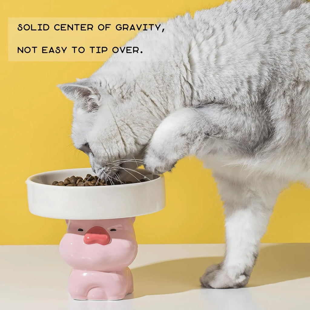 Raised ceramic cat bowl with animal theme design in pink, yellow, or white.