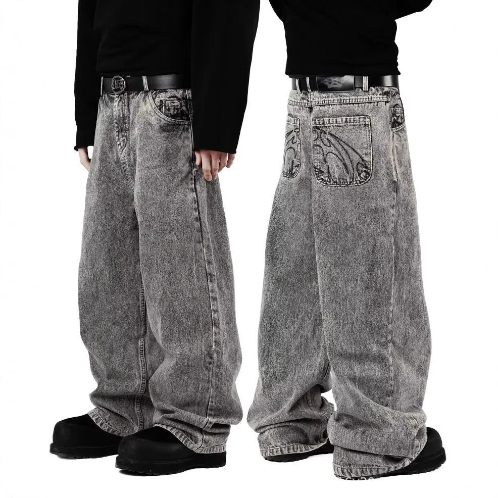 Grey loose straight-leg denim trousers showing mid-waist design and relaxed fit
