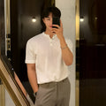 Men's black thin slim-fit ice silk knitted short-sleeved shirt on a hanger.