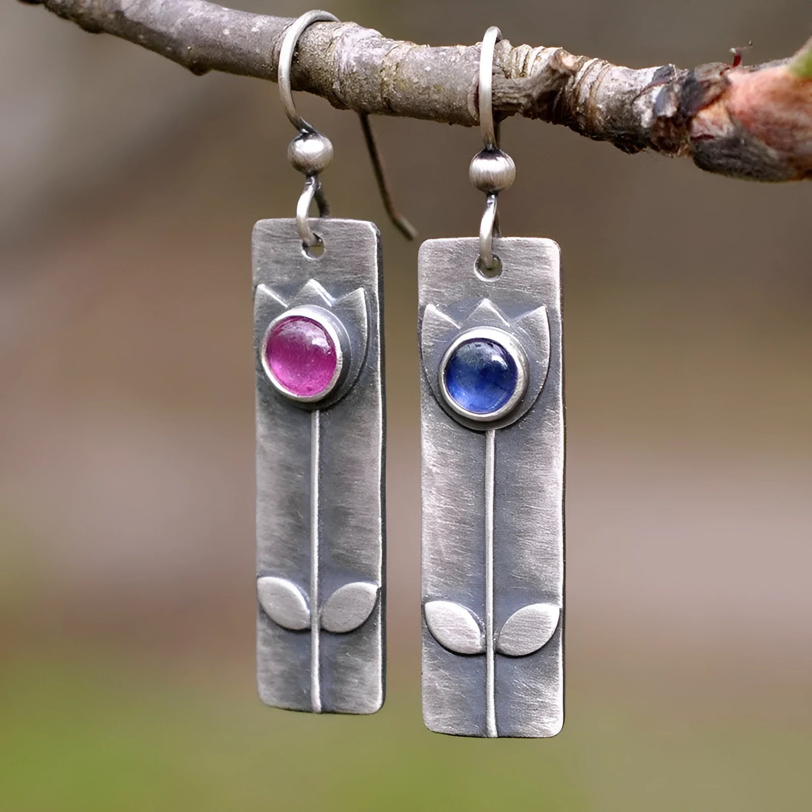 Antique finish red sapphire earrings with geometric ellipse design on electroplated metal