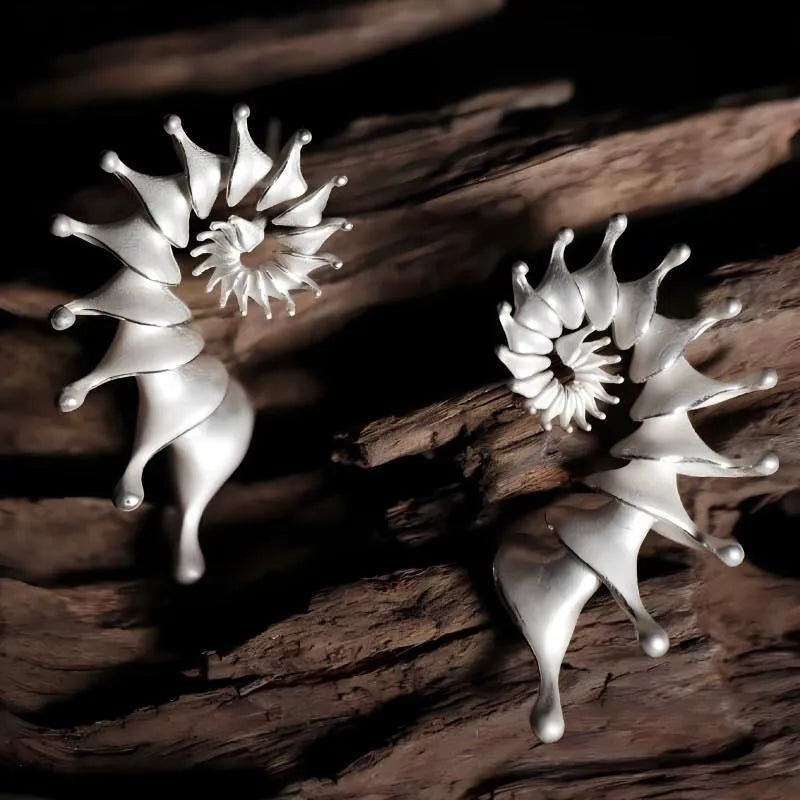 Three-dimensional matte finish conch shell stud earrings with exaggerated design and irregular patterning