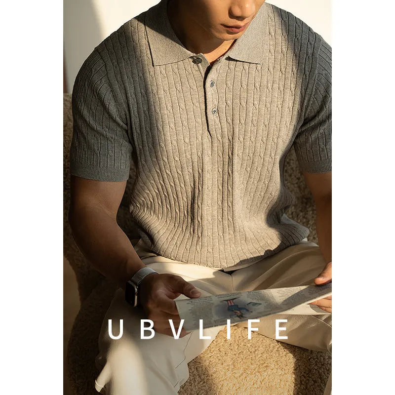 A man's khaki short-sleeve business commute top laid flat, showing its collar and sleeve detail.