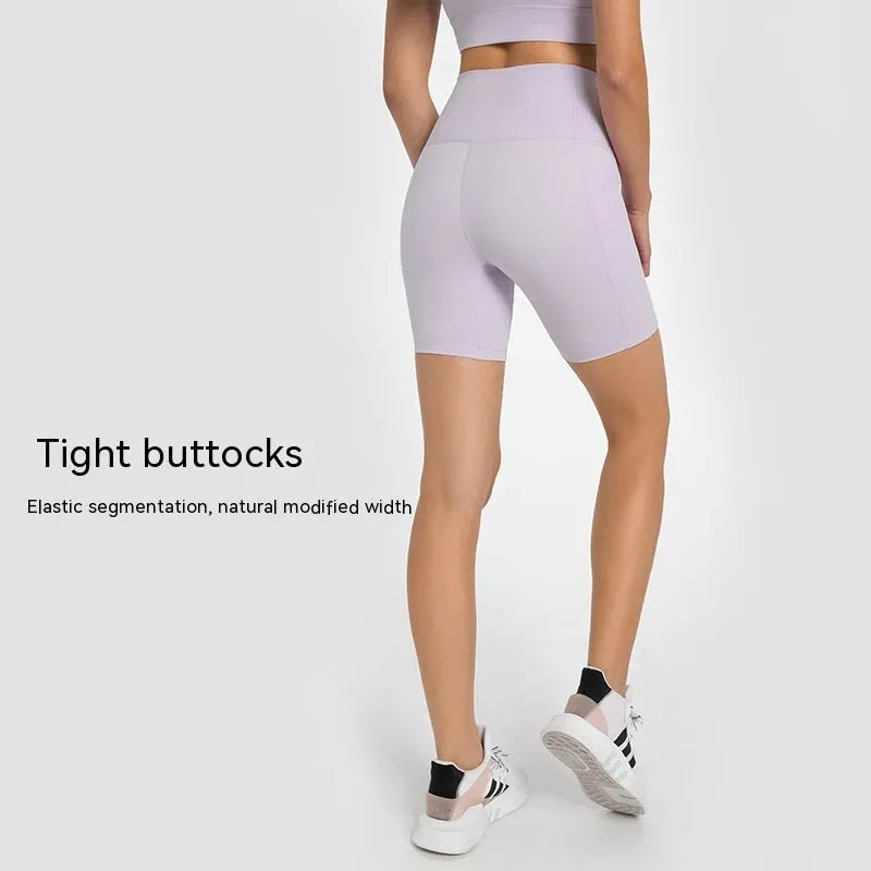 Women's solid colour mid-length sports shorts with super stretch cotton blend fabric.