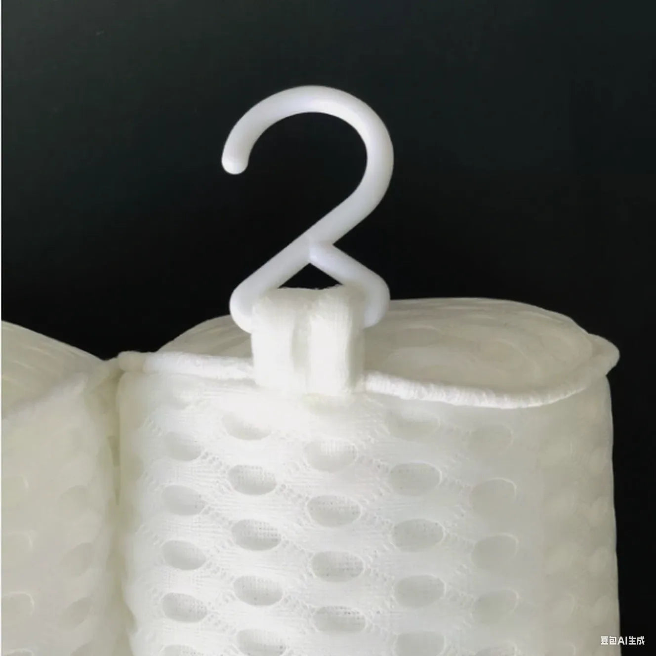 White 3D mesh bathtub pillow with multiple suction cups, shown on a bathtub.