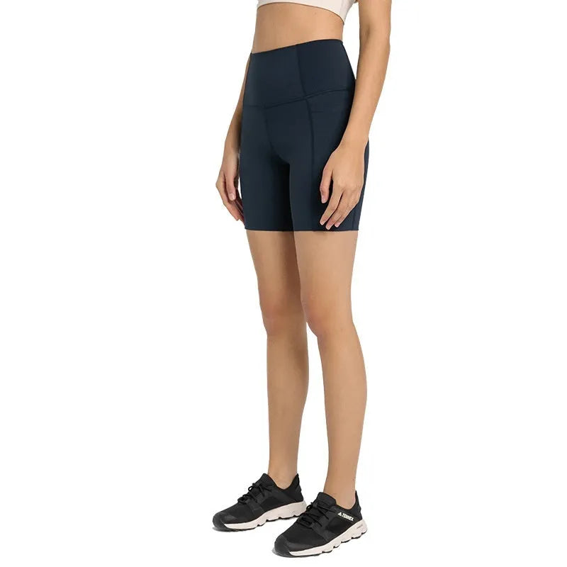 Women's solid colour mid-length sports shorts with super stretch cotton blend fabric.