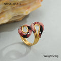 Leopard print geometric open mouth ring on a finger, showing heart shape and adjustable stainless steel band.