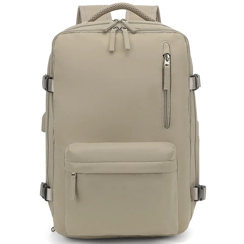 Large capacity women's travel backpack in light grey colour with curved shoulder straps