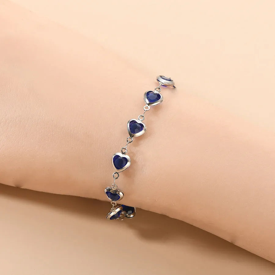 Geometric heart-shaped stainless steel bracelet with electroplated colourful finish on wrist