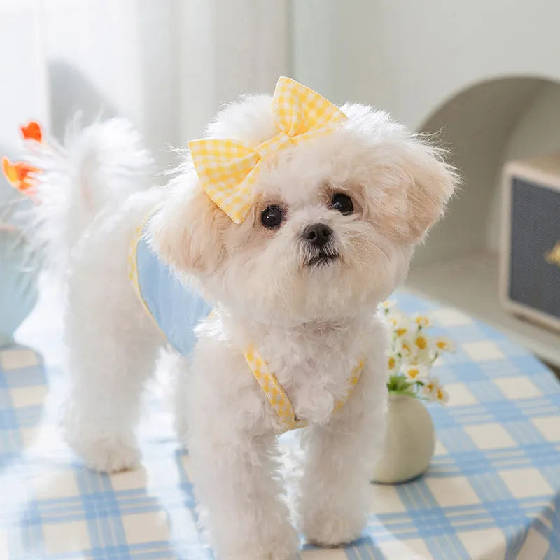 Small dog wearing heart texture bow suspenders vest in elastic material