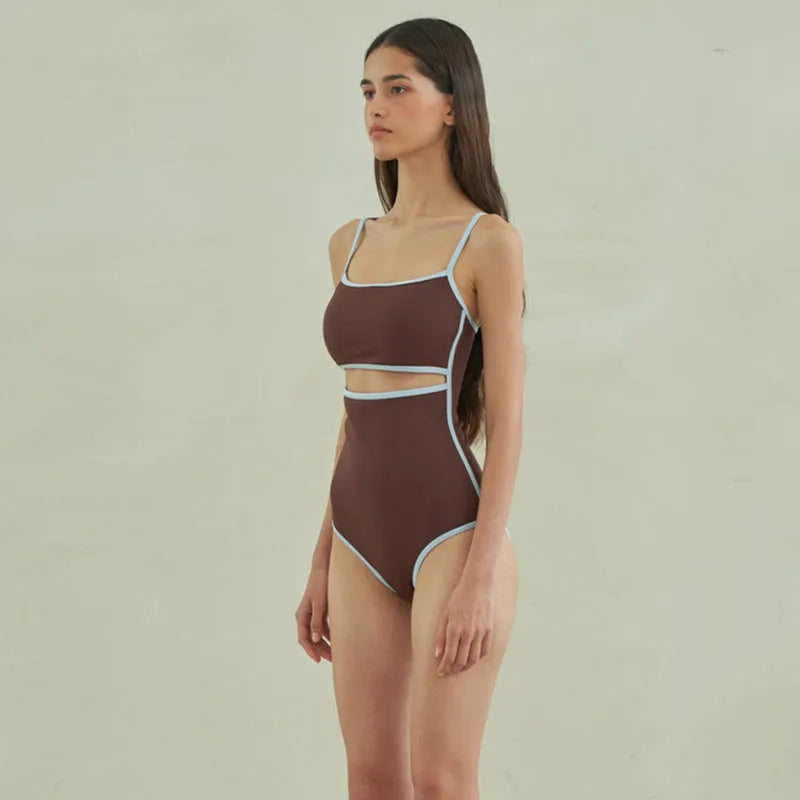 Brown women's one-piece swimsuit with a triangle top on a mannequin.