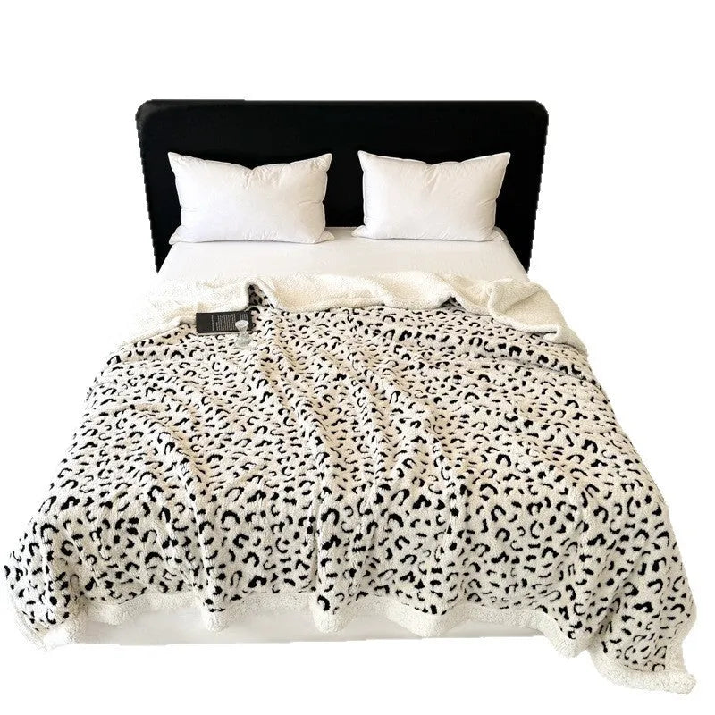 Double-layer leopard print jacquard taffeta blanket shown in camel zebra pattern