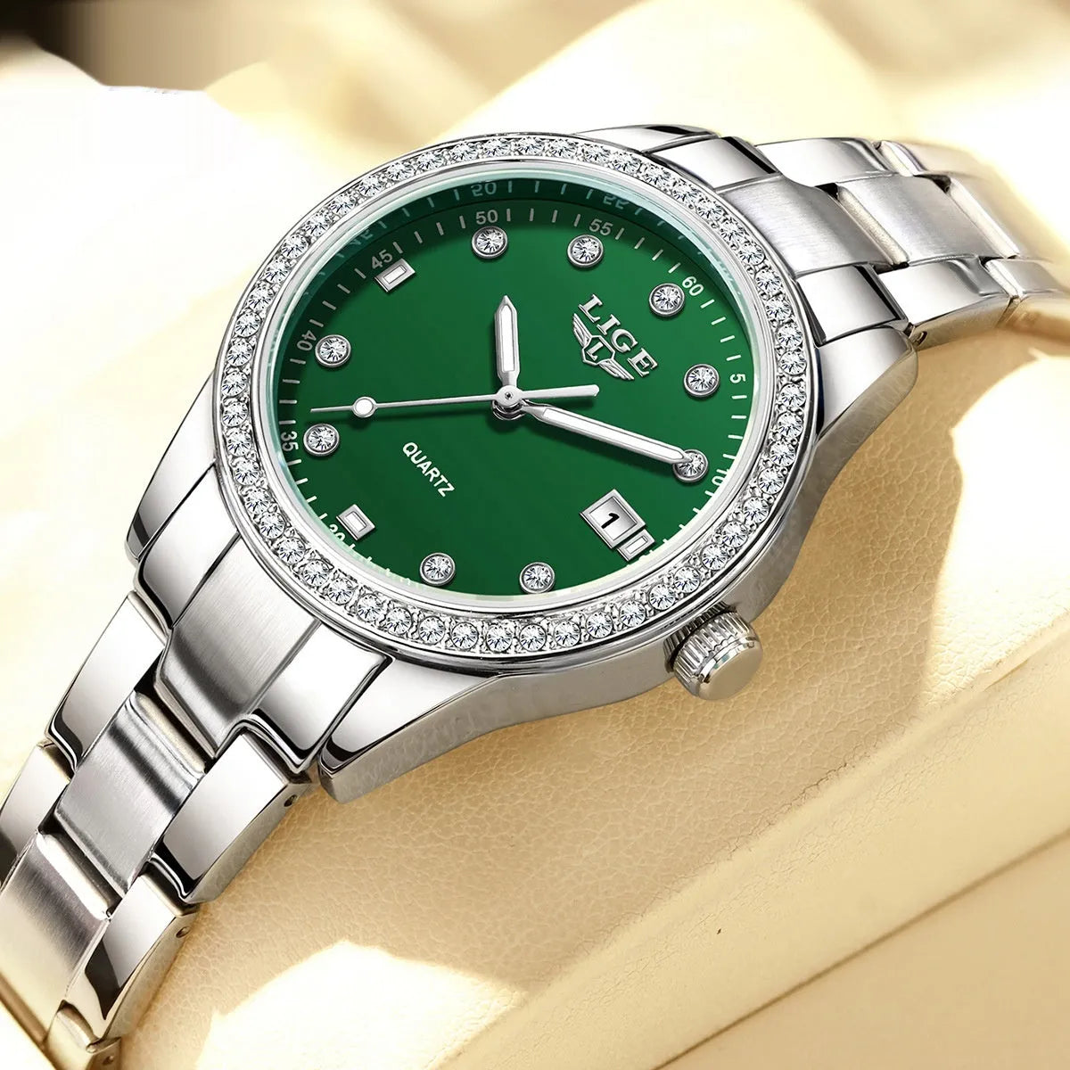 Women's silver quartz watch with diamond hour markers and luminous hands on 34mm round dial